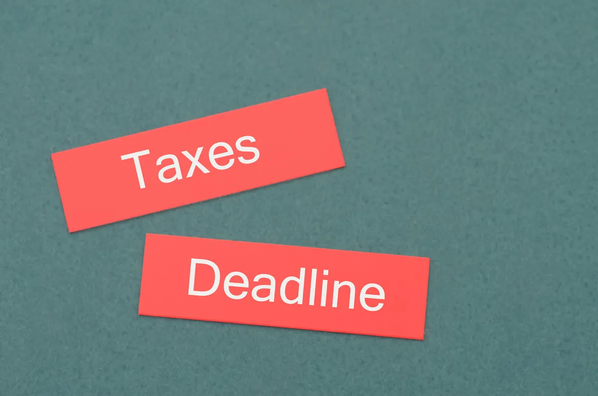 Accountant reviewing W-2 and 1099 tax forms for the 2027 filing season